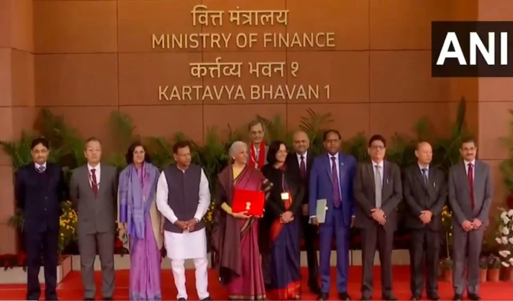 Budget 2026 | मरून कांजीवरम साड़ी में कर्तव्य भवन पहुँचीं Nirmala Sitharaman, अपनी तमिल विरासत को दिया सम्मान Budget 2026 | मरून कांजीवरम साड़ी में कर्तव्य भवन पहुँचीं Nirmala Sitharaman, अपनी तमिल विरासत को दिया सम्मान