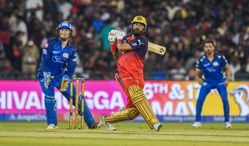 rcb knocks out mumbai indians in a thrilling match climbs to the top of the table