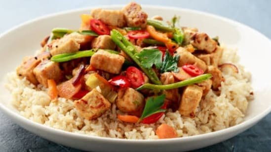 Quick Tofu Vegetable Stir Fry For A Nutritious Plant-Based Meal With Peanut Sauce And Fresh Produce Quick Tofu Vegetable Stir Fry For A Nutritious Plant-Based Meal With Peanut Sauce And Fresh Produce